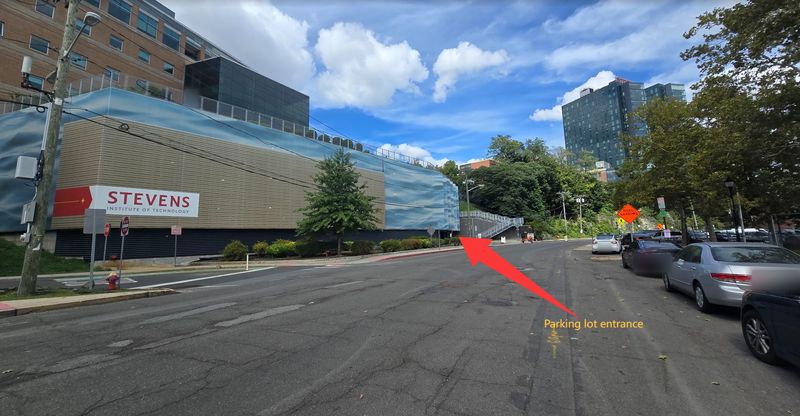 Frank Sinatra Drive with the Stevens garage on the left; a red arrow points to the garage entrance